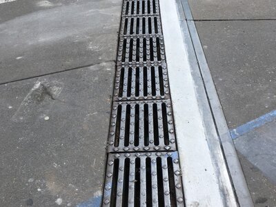 DRAIN GRATE  & DRIVEWAY AFTER